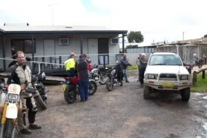 Photo of riders refuelling their bikes before the day starts.